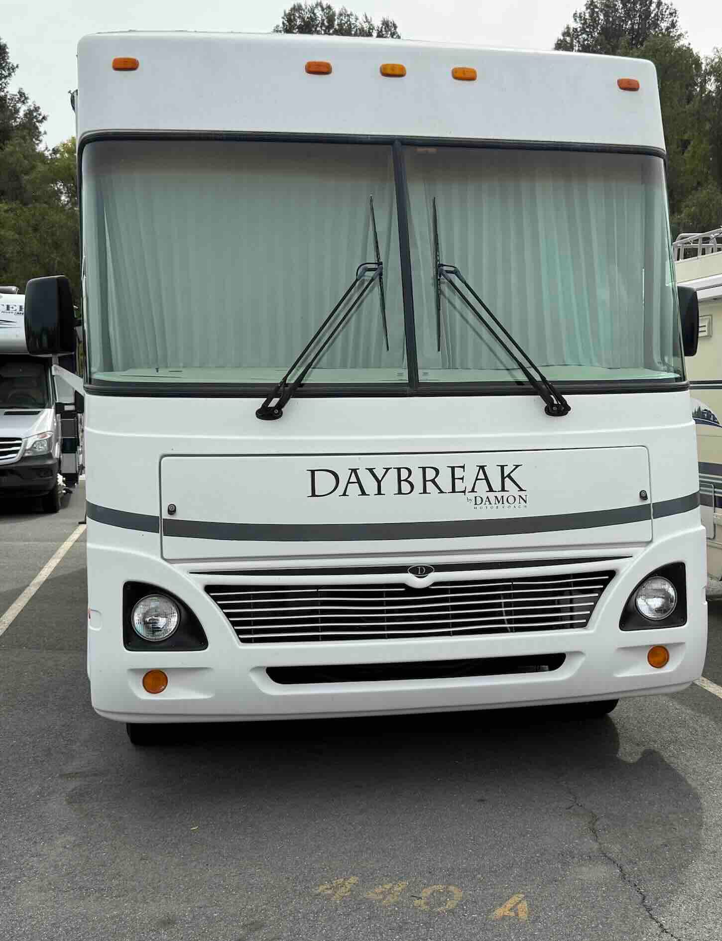 We pay cash for RVs, motorhomes, fifth wheels, and travel trailers. If you're saying to yourself, "Sell my RV," look no further. We service all of Southern California. This is an image of a Class A Damon Daybreak motorhome.