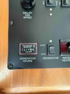 Hobbs generator panel with hours, featured in a1rvbuyer.com’s blog on essential RV generator tips.