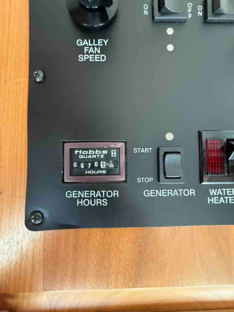 Hobbs Generator Panel – Essential Tips for RV Generators on a1rvbuyer.com - A1 RV Buyer Hobbs generator panel with hours, featured in a1rvbuyer.com’s blog on essential RV generator tips.